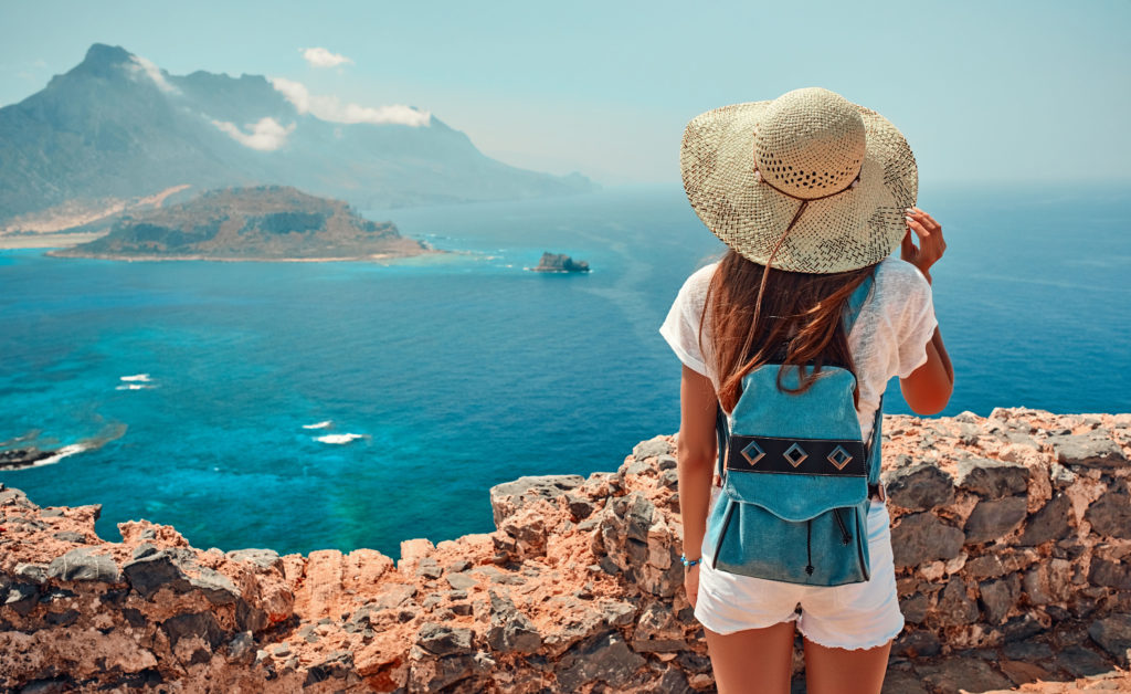 person looking over beach use a travel agency ma